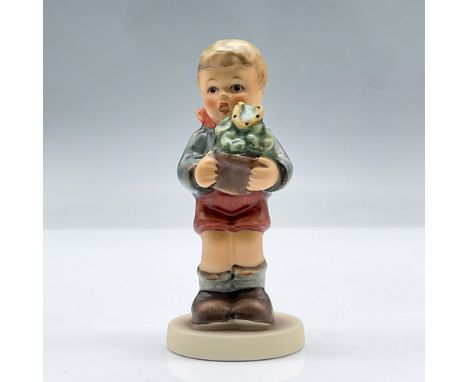 Small figurine of a boy holding a potted plant with a lucky horseshoe. M.I Hummel Club, Membership year 1999/2000. This item 