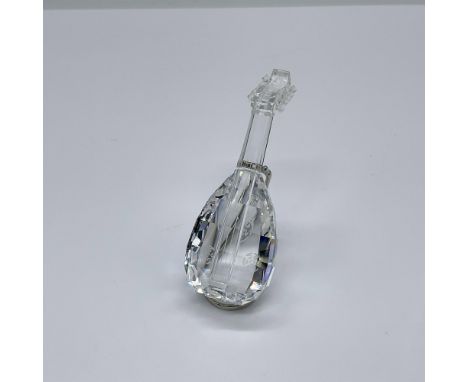 Part of the Crystal Melodies collection. A clear crystal string instrument. Includes a rhodium metal stand. Swarovski swan ma