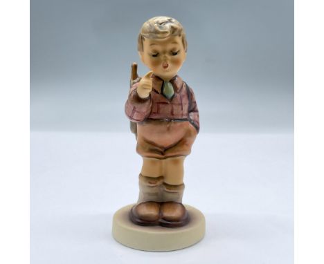 Figure of a boy carrying a backpack. Exclusive Edition 1996/97 M.I Hummel Club. This item has its original box measuring 5.5"