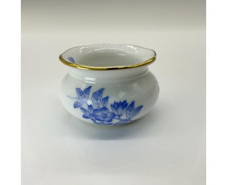 This small porcelain pot is gilded with gold and hand decorated with blue flowers and butterfly. This item has its original b