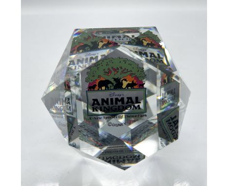 Limited edition Swarovski crystal paperweight designed with Animal Kingdom signage. Felt bottom protects base. Arribas Bros. 