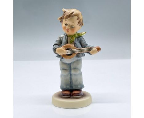 Small figure of a boy playing a string instrument. Exclusive edition 1994/1995 M.I Hummel Club. This item has its original bo