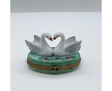 Hand painted porcelain decorative oval box for jewelry with two swans swimming on the top of a lake. Baby ducks in the inside