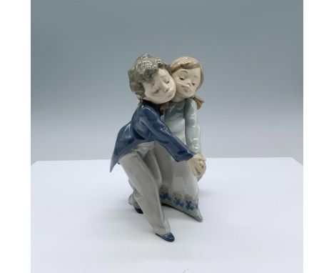 Glossy finish. Features a charming couple of young dancers cheek to cheek holding hands.. Lladro backstamp. This item has its