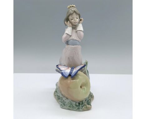 Glossy finish. Features a charming girl in a gown, being swept by the breeze with a giant peach and a butterfly. Lladro backs