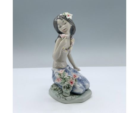 Glossy finish. Features a charming girl smelling a flower. Lladro backstamp. This item has its original box. Box measures 8"L