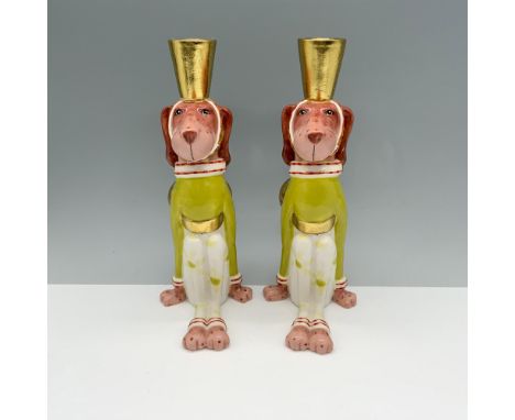 Marvelous duo of canines sitting down with bows around their waist as they wear candlestick holders on their heads. Patience 