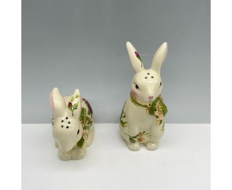 Lovely duo of porcelain figures with floral decor depicting a rabbit standing and a rabbit resting on all fours. Royal Albert