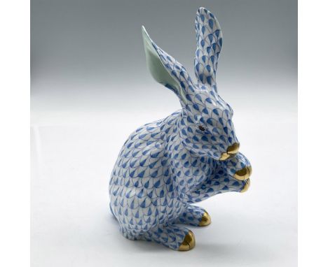 Hand painted blue over white porcelain figure with paws up accented with light green on ears as well as gilded nose and paws.