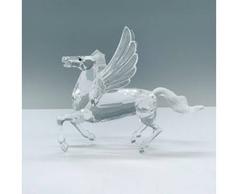 A majestic Pegasus with wings spread wide stands on all fours, one hoof slightly raised, ready to take flight. Swarovski back