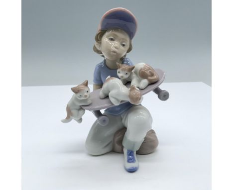Glossy finish. Features a skater boy sitting with three cats in his board.. Lladro backstamp. Marked Lladro 1994 event figuri