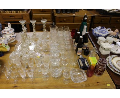 A quantity of various drinking glasses; a glass dressing table set; various bottles of ale; a hip flask; a soda syphon etc.