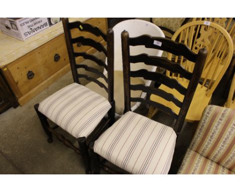 A pair of early 19th Century Lancashire oak ladder back dining chairs