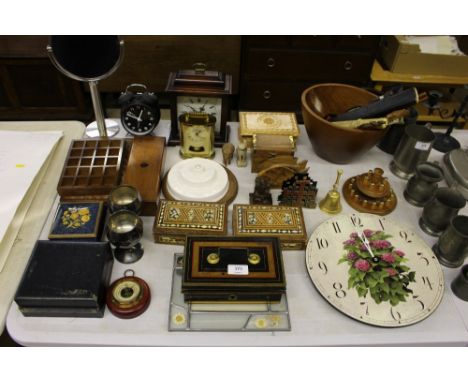 A cash tin; a wooden mantel clock; a teak fruit bowl; various letter openers; a wooden and brass thimble stand; a wall clock;