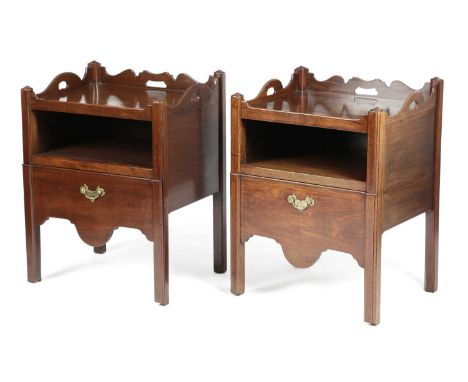 A PAIR OF GEORGE III MAHOGANY TRAY-TOP BEDSIDE COMMODESCHIPPENDALE PERIOD, C.1760each with a scrolling gallery pierced with h
