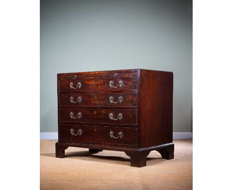AN EARLY GEORGE III MAHOGANY CHESTC.1760the caddy moulded top above a brushing slide and four graduated long drawers, the top