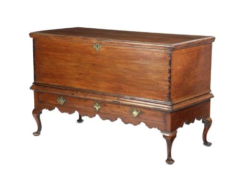 A RARE BERMUDAN CEDAR TRUNK ON STAND MID-18TH CENTURYthe hinged top revealing a vacant interior, above a false drawer front a