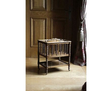 λ A LATE GEORGE III ROSEWOOD CANTERBURYC.1800with four divisions and a central carrying handle, with bobbin turned supports a