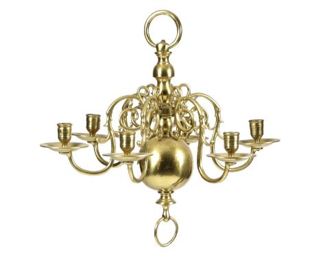 A SMALL DUTCH BRASS SIX-LIGHT CHANDELIER18TH CENTURYwith a turned stem and detachable scroll arms with dished drip-pans and u