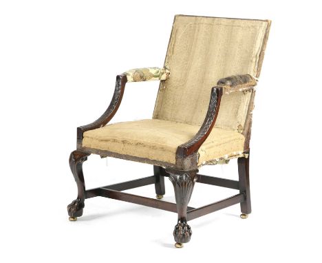 AN IRISH MAHOGANY GAINSBOROUGH ARMCHAIR18TH CENTURY AND LATERthe downswept arms carved with leaves, on shell capped cabriole 
