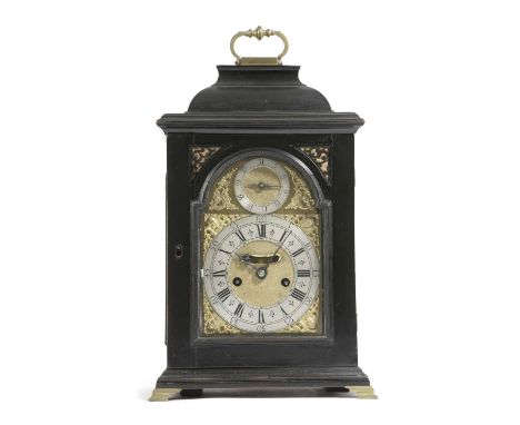 AN EBONY TABLE CLOCK18TH CENTURY AND LATERthe brass twin fusee movement with an anchor escapement and striking on a bell, the