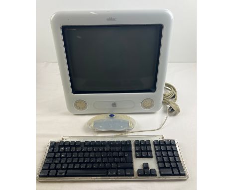 A 2003 Apple eMac all-in-one desktop computer, model A1002. With keyboard, power cable and Ram access door. 