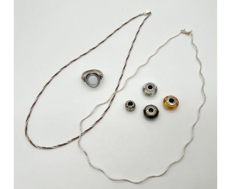 A small collection of silver and white metal jewellery. 2 silver necklaces, one tri coloured, together with a dress ring set 