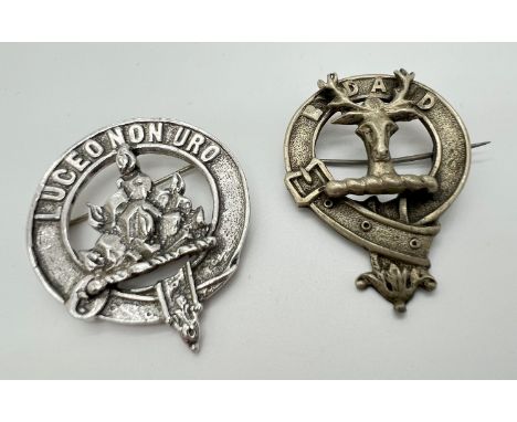 2 vintage white metal Scottish clan pin back badges. A circular belt design badge with stags head detail and the work BYDAND 