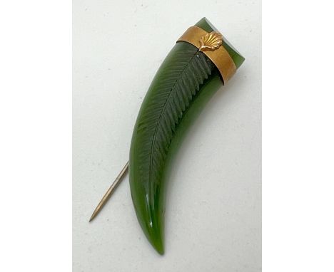 A Victorian nephrite jade claw shaped stick pin brooch with 14ct gold banded detail. Unmarked but tests as 14ct. Hinged stick