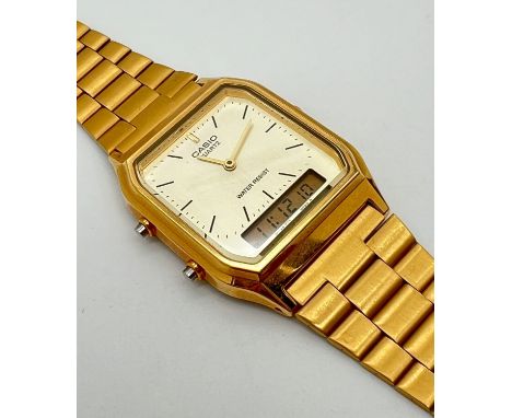 A Casio AQ-230 quartz and digital display watch with stainless steel gold tone strap and case. Casio name to face and strap f