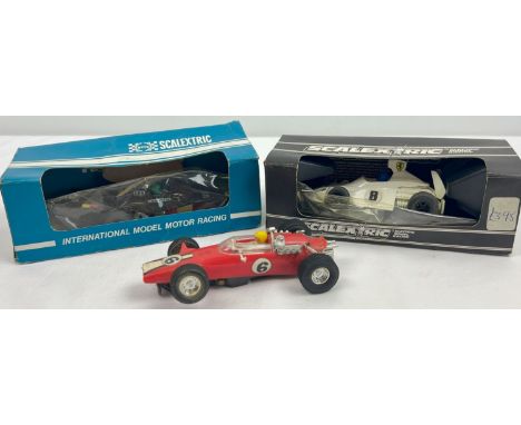 2 boxed and 1 unboxed Scalextric model racing cars. C.120 Martini Brabham BT 44B, C.123 UOP Shadow Formula 1 car and a red No