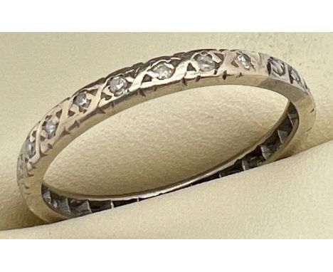 A vintage gold and diamond full eternity ring, unmarked but tests as 22ct gold. Ring size R. Looks to have been resized/made 