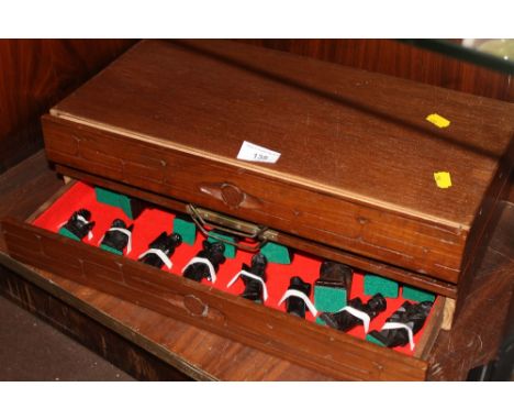 A CARVED CHESS SET WITH ORIENTAL STYLE BOARD 