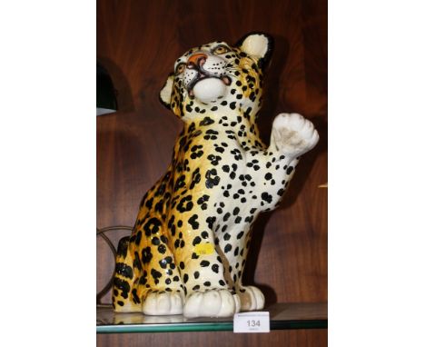 A CERAMIC FIGURE OF A LEOPARD