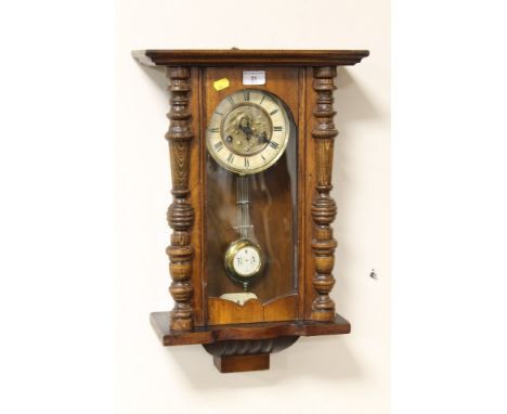 A OAK CASED WALL CLOCK