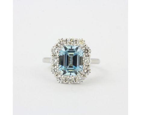 A 9ct white gold ring set with an emerald cut aquamarine surrounded by labr grown brilliant cut diamonds, ring size O, aquama