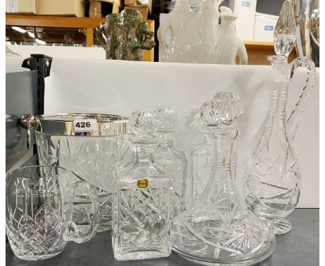 A cut glass and silverplate ice bucket, H. 22cm. Together with a quantity of Webb and other crystal decanters.