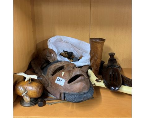 A carved tribal mask together with a part chest set, further wooden items and a 1950's tennis racket.