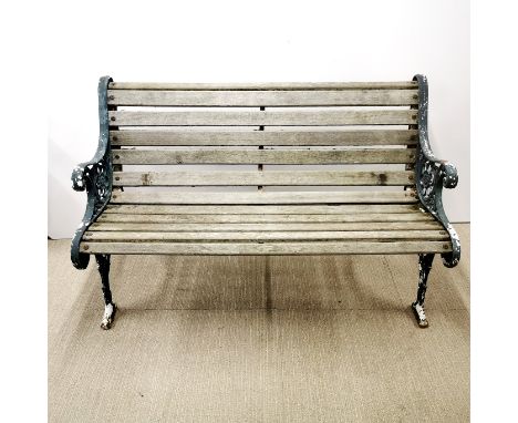 A heavy cast iron garden bench, 126 x 79 x 60cm.