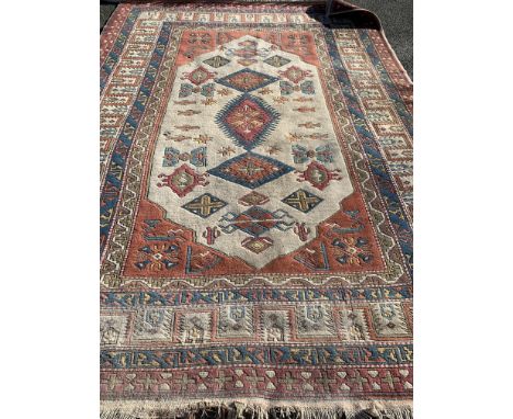 A hand woven Turkish wool carpet, W. 228cm L. 310cm.