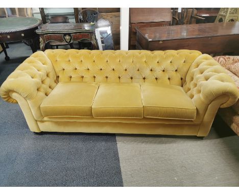 A button backed chesterfield three seater sofa, L. 225cm.