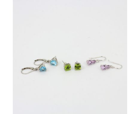 Three pairs of 925 silver stone set earrings including amethyst, peridot and blue topaz, longest L. 2.8cm.