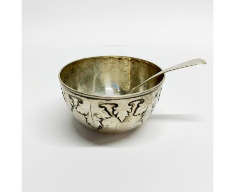 A hallmarked silver bowl with a hallmarked silver spoon, bowl Dia. 10.5cm.