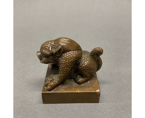 A Chinese cast bronze scholars seal, 5.5 x 5.5 x 6cm.