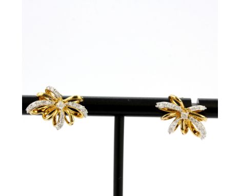 A matching pair of 9ct yellow gold diamond set stud earrings, L. 1.5cm.