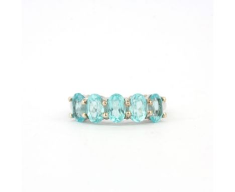 A 925 silver ring set with five oval cut apatites, ring size M.