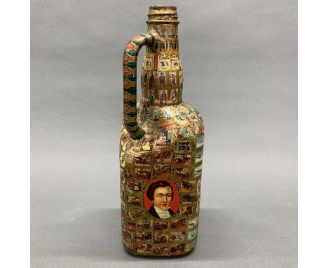 An interesting cigar label decorated bottle, H. 33cm.