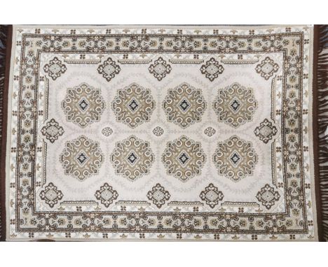 A brown and cream ground rug, 198 x 137cm.