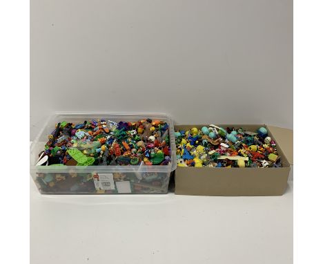 A large quantity of mixed Kinder and other small toys/figures.