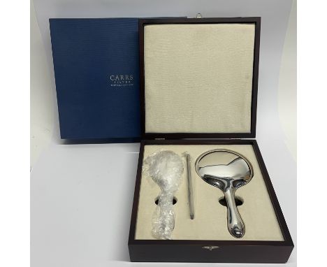 A wooden boxed presentation hallmarked silver hand mirror, handbrush and comb.